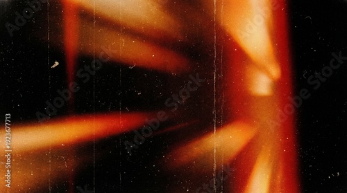 Vibrant orange abstract background with dynamic light streaks