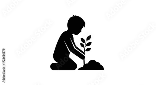 A child kneels planting a young tree in soil with care and attention to nature.
