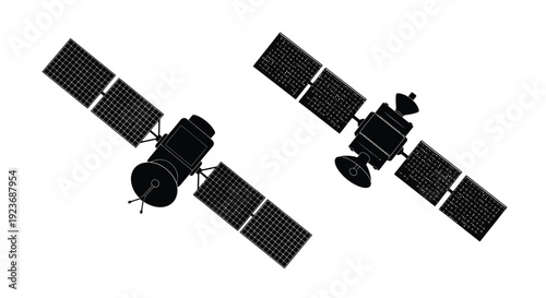 Two communication satellites with deployed solar panels in space