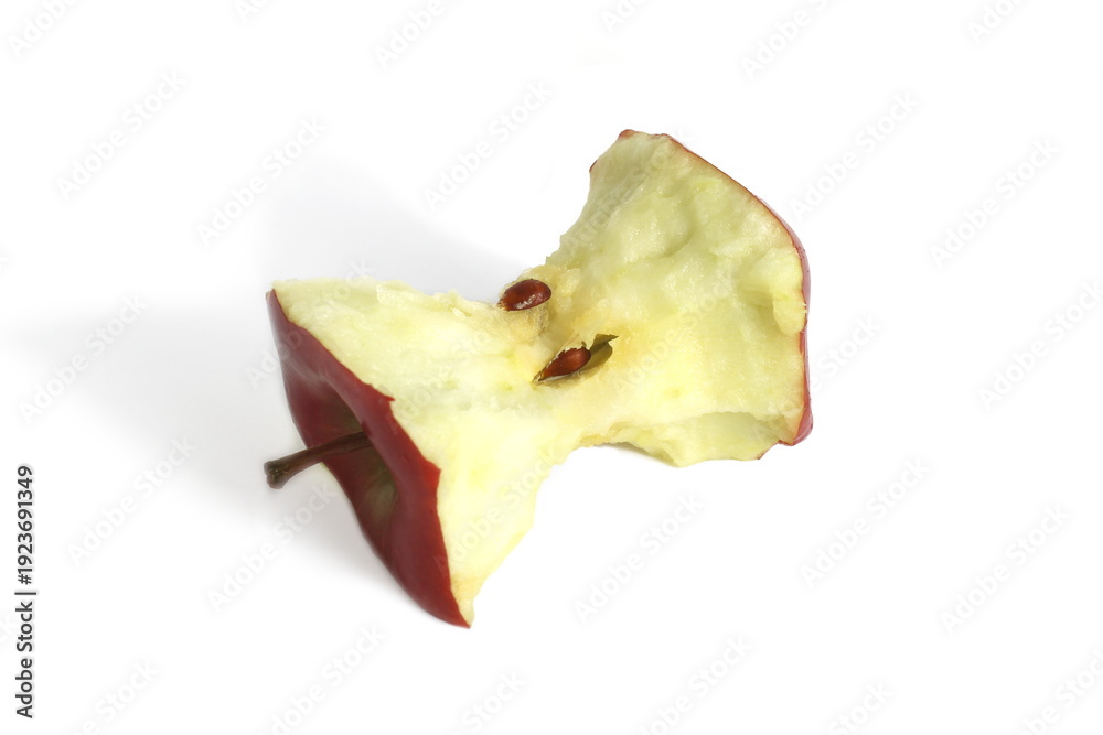 Naklejka premium There is an apple core lying on a white background.