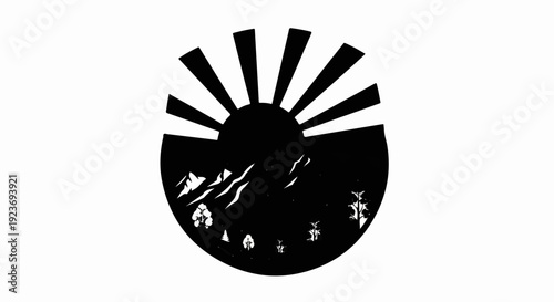 Silhouette of a sun rising over mountains and trees