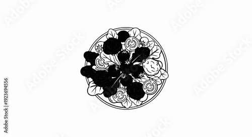 Overhead view of a circular plate filled with a fresh salad featuring dark round items and sliced tomatoes