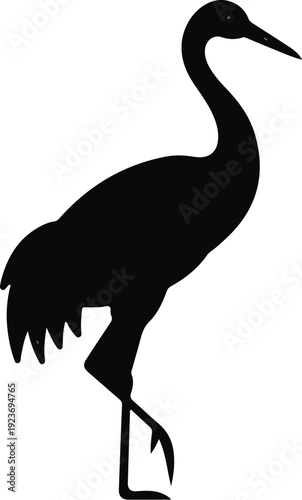 Silhouette of a crane standing on one leg