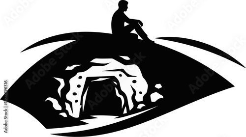 Silhouette of man sitting on an eye containing a cave entrance