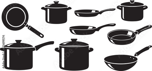 Collection of black kitchen pots and pans on white