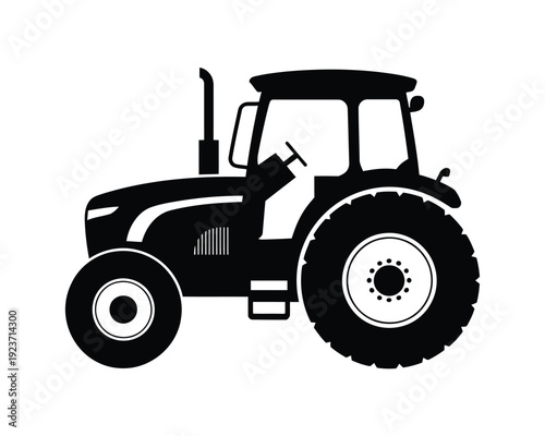Black and white tractor silhouette with large rear wheel and enclosed cabin