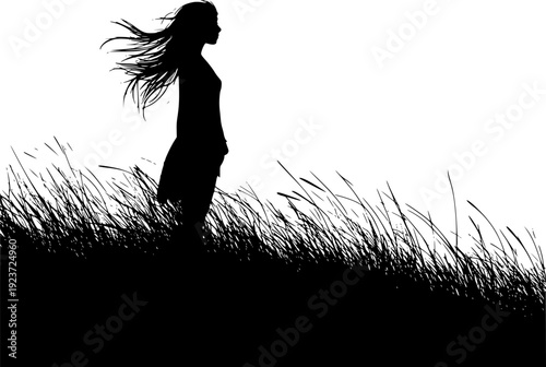 Silhouette of a young girl with long hair flowing in the wind