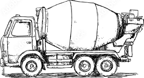 A yellow cement mixer truck on a gray road