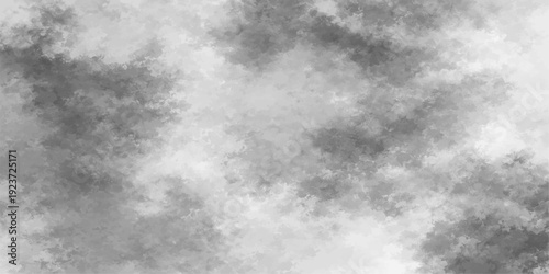 A dramatic cloudscape of dark storm clouds gathering against a blue sky background creates an abstract nature atmosphere with bright white light breaking through the overcast summer air