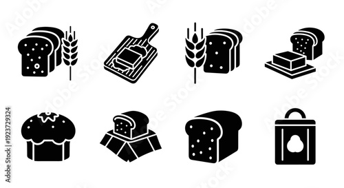Monochrome bakery icons set: bread, butter, and wheat elements in silhouette style