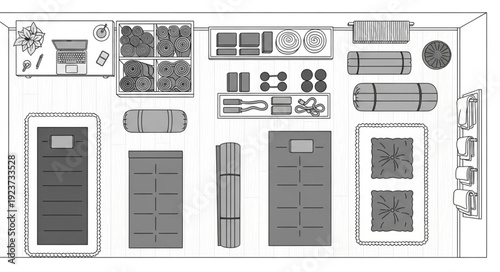 Camping gear arrangement with sleeping bags, mats, and various equipment for outdoor adventures.