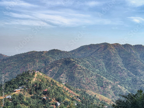 Obraz na plátně The mountain ranges of Mirama rise confidently beneath a clear blue sky, their peaks shaping a breathtaking landscape filled with openness and quiet grandeur