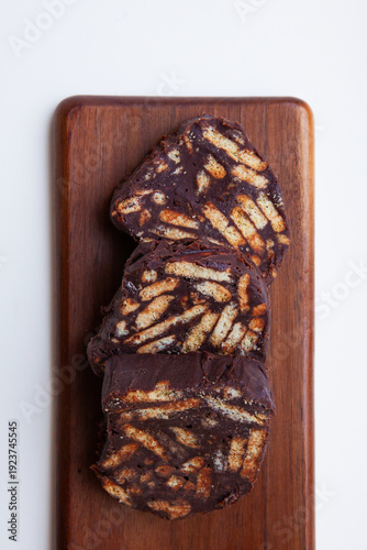 sliced of chocolate cake on a wooden board