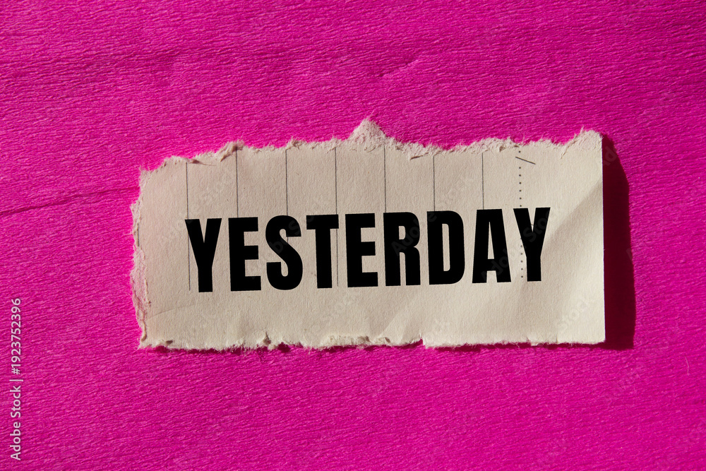 Фотография Yesterday message written on ripped torn paper background
