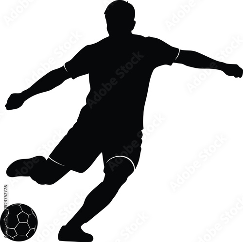 Soccer player silhouette powerfully kicks ball forward demonstrating.