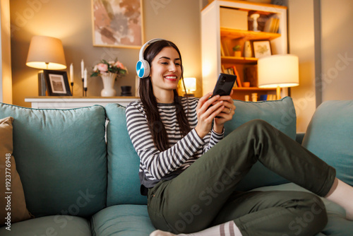 Woman taking online foreign language course using smart phone