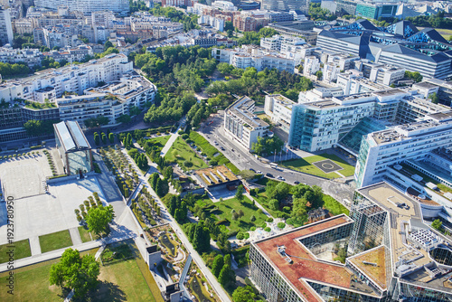Bild auf Leinwand Panoramic aerial view of Paris with green trees, residential buildings, and Mont