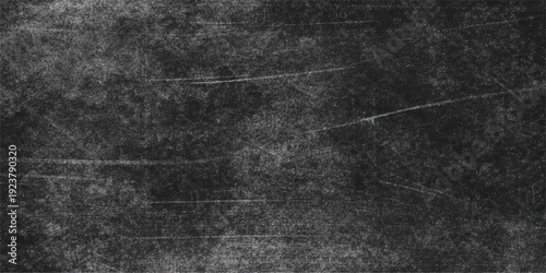 An abstract black and white grunge background features a dark textured chalk board surface with aged grey stone and rough scratched concrete patterns for a vintage wall design