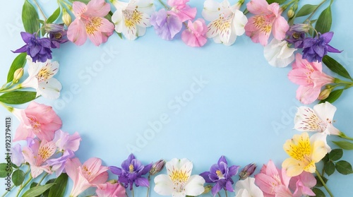 Floral border of alstroemeria and sweet peas on a light blue background.