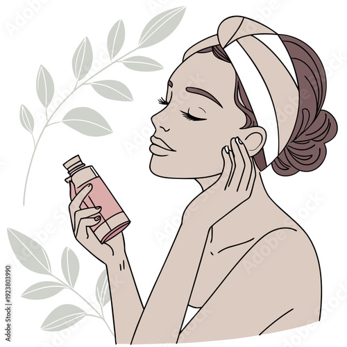 Woman applying pink skincare product to face with towel on head