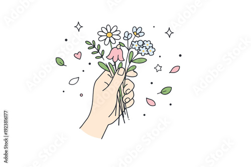 Wildflower gathering scene. Hand holding freshly picked flowers with small petals and leaves scattered subtly around, viewed from above.