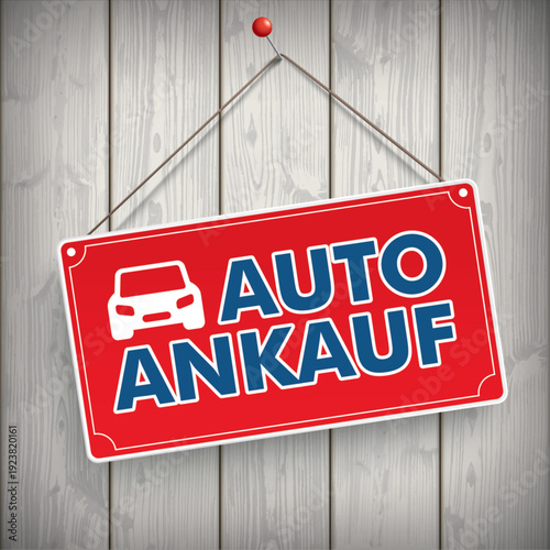 Schild mit dem Text Autoankauf auf einer Holzwand