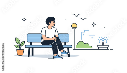Young man sitting on a park bench enjoying a peaceful day outdoors with city buildings in the background