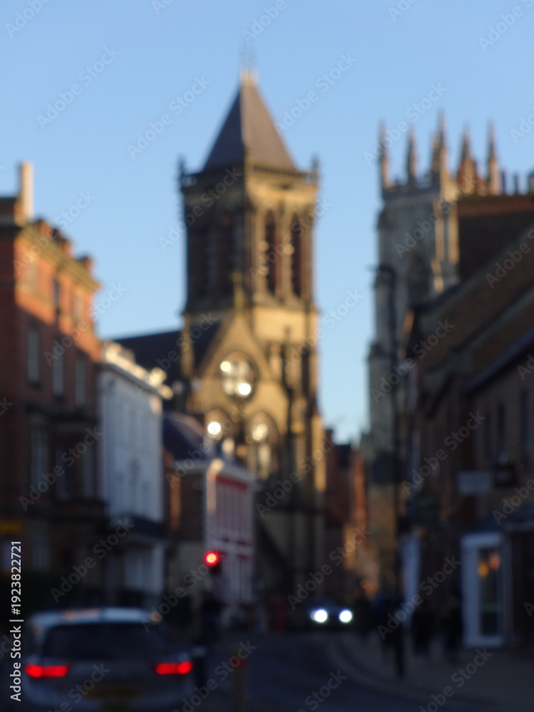 Naklejka premium Blurred York church street at sunset England