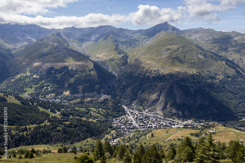 Summer aerial view of the town and ski resort of Valloire, and the surrounding alpine mountains in Savoie, France.
