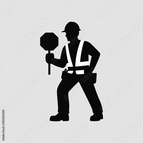 Silhouette of a construction worker holding a stop sign 1