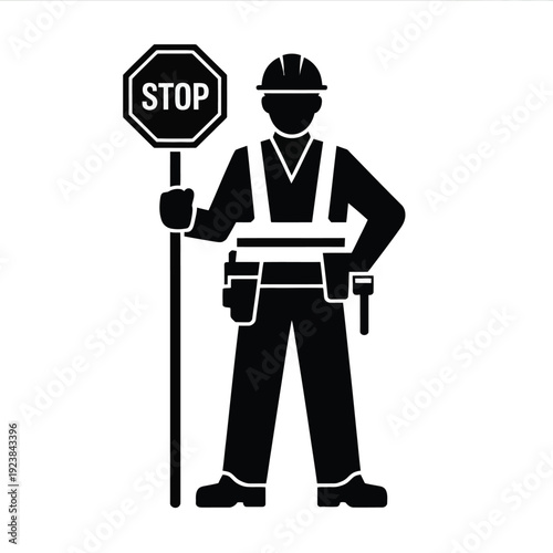 Black and white of a construction worker holding a stop sign