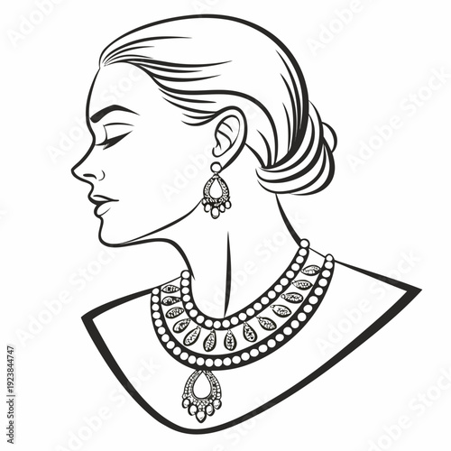 Black and white of woman's head and shoulders wearing ornate gold bridal jewelry