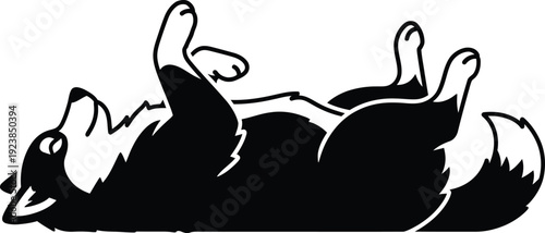 Happy dog playful pet resting. Fluffy dog lying down with one paws raised.