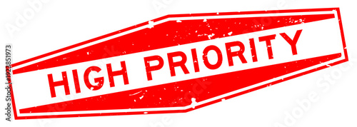 Grunge red high priority word hexagon rubber seal stamp on white background