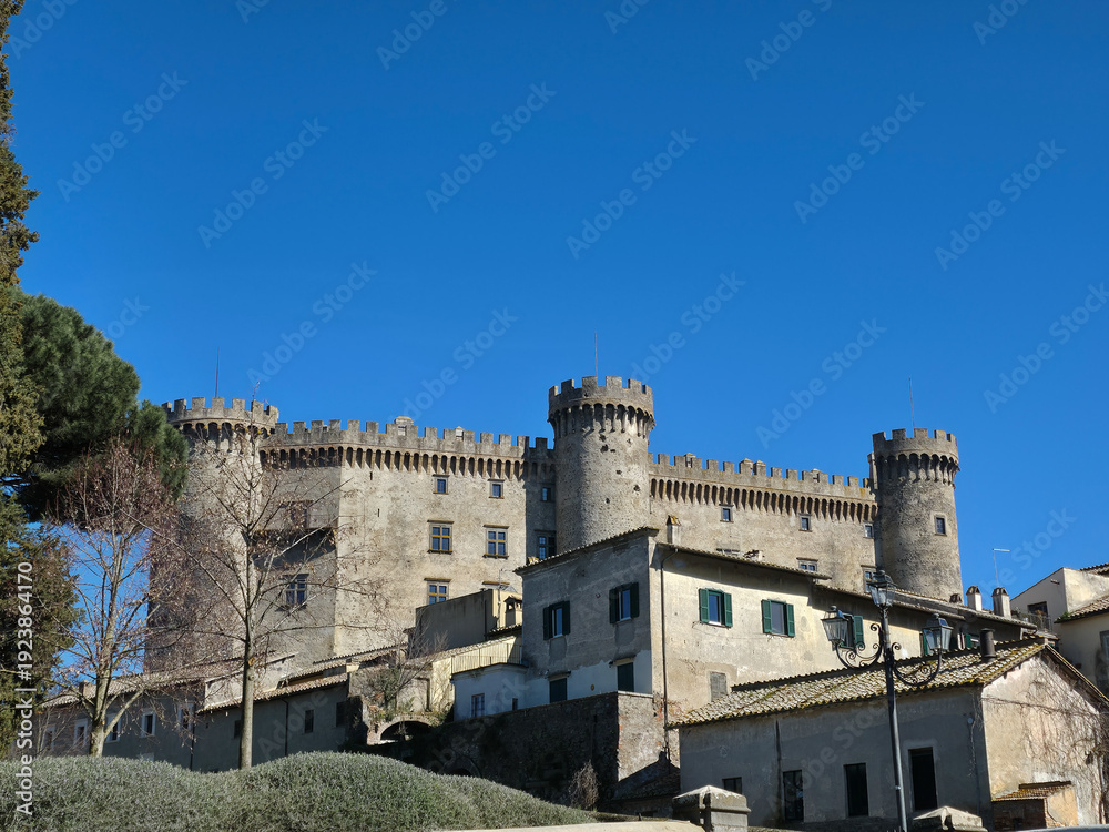 Obraz premium Majestic Orsini-Odescalchi Castle in Bracciano under Clear Blue Sky, 15th Century Renaissance Fortress in Lazio, Italy