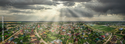 Dramatic Sunbeams over Suburban Town Aerial Panorama