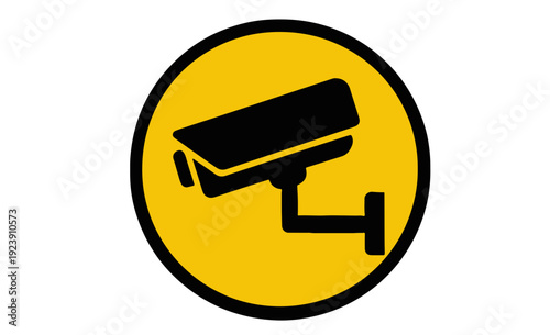 Yellow circle with black security camera symbol surveillance