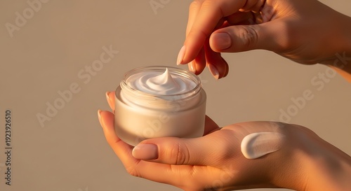 Close-up of Hands Applying Moisturizing Cream from a Jar