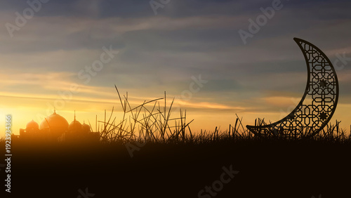 A beautiful silhouette of a mosque and an ornate crescent moon in a field during a vibrant golden sunset. Ideal for Ramadan Kareem, Eid Mubarak, and Islamic religious celebrations