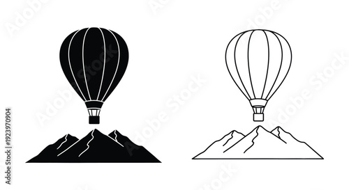Two hot air balloons over mountains a distinct black silhouette