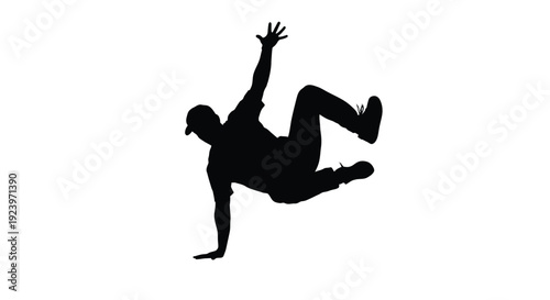 Dynamic breakdancer in mid air pose a striking black silhouette