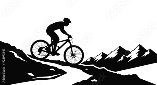 Mountain biker riding downhill a striking black silhouette