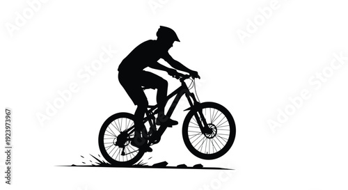 Mountain biker in action dynamically riding on a trail silhouette