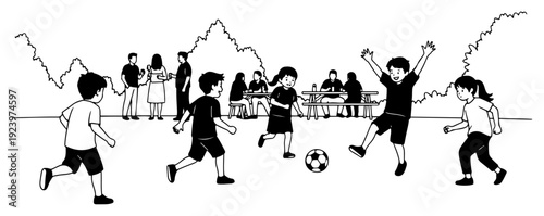 Group of children playing soccer in a park during outdoor family picnic