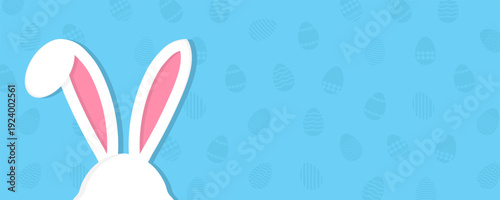 Easter bunny ears background in pastel colors. Minimal holiday composition with patterned eggs. Soft blue festive backdrop