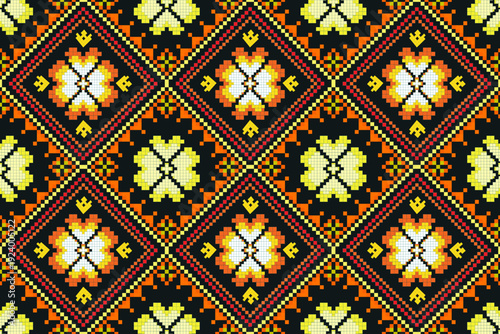 Symmetrical pixel-style geometric pattern arranged in a seamless repeat, featuring diamond shapes with central floral motifs. The yellow, orange, red, and black .