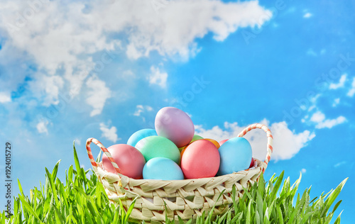 Wallpaper Mural Wicker basket filled with colorful easter eggs against sky Torontodigital.ca