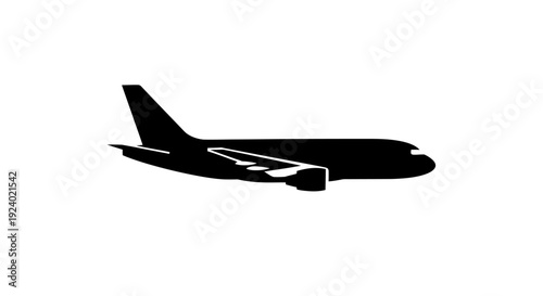 Silhouette of Passenger Airplane in Flight Against White Sky