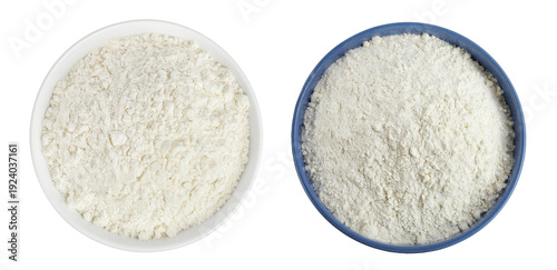 White flour in ceramic bowl isolated on white background. Top view. Flat lay.