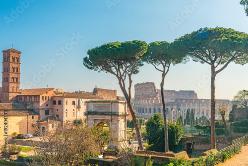 Obraz na plátne Rome cityscape with Colosseum, Arch of Titus, Basilica and bell tower of Santa Francesca Romana in Roman forum at sunrise